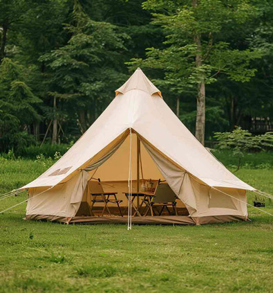 Beige camping tent made of PE fabric set up on grass in a forested area