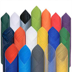 Roll of green PE fabric with texture detail