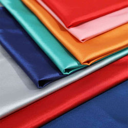 Assorted colorful polyester fabric sheets with smooth and shiny texture