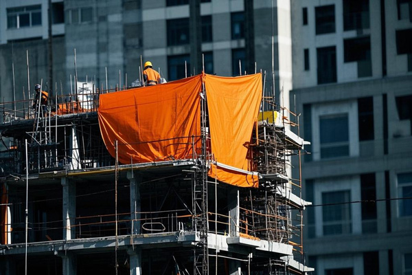 Construction site dust and rain proof tarpaulin covering materials and equipment
