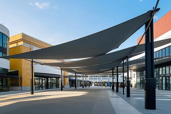 Commercial plaza large sunshade fabric providing extensive coverage with wind resistance