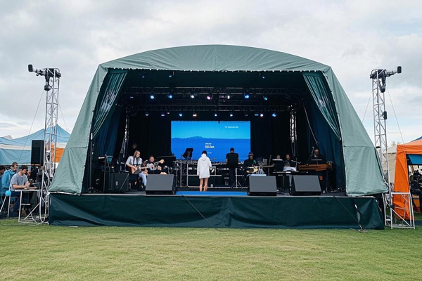 Temporary stage side rain covers for outdoor concerts and festivals