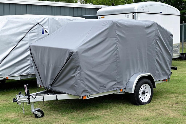 Oxford fabric trailer cover protecting cargo from weather elements during transport
