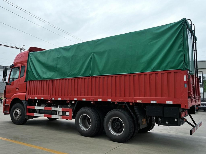 Heavy duty PVC truck tarp covering a large cargo truck