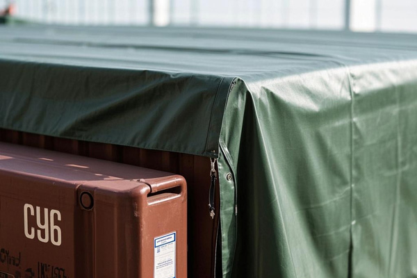 Reinforced container tarps