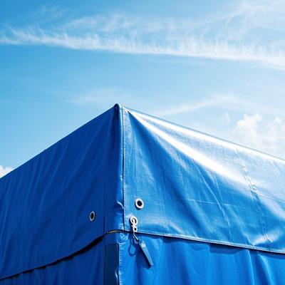 Refrigerated truck fleet with cold-resistant tarps