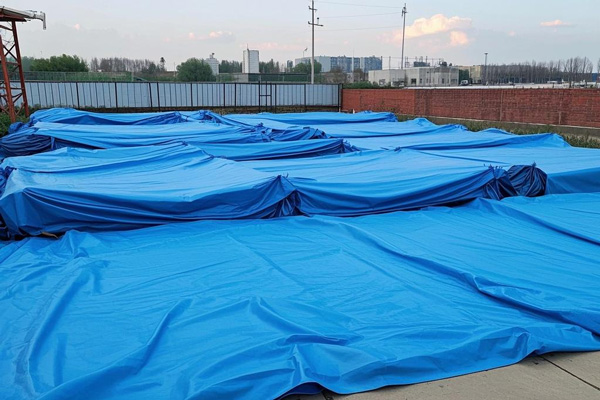 Tarp used as dust barrier on construction site