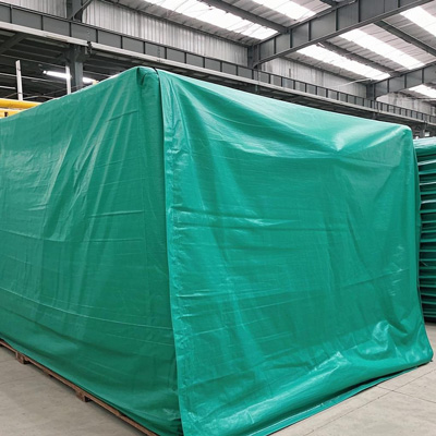 Tarp secured over pallet racking