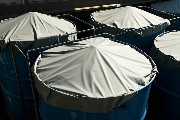 Hazardous material storage area with protective covers