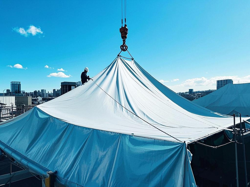 Heavy-duty PVC roof tarp covering construction site shelter