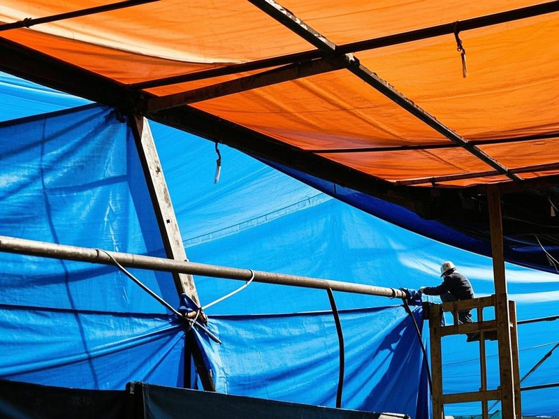 Waterproof roof tarp during rainstorm