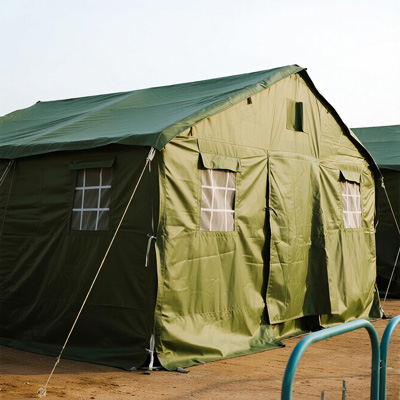 Aid workers setting up relief tarp shelter