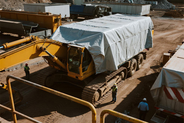 Mining equipment covered with heavy duty tarp