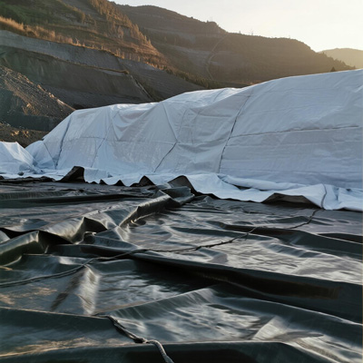 Large mine stockpile covered with heavy duty tarp