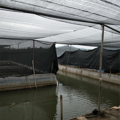 Adjustable shade system over aquaculture nursery