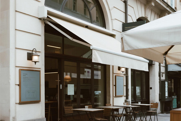 Restaurant with fixed awning covering outdoor dining area