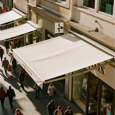 Urban retail shops with coordinated awnings creating street appeal