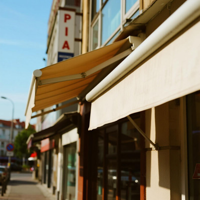 Hotel entrance with large commercial awning identifying property