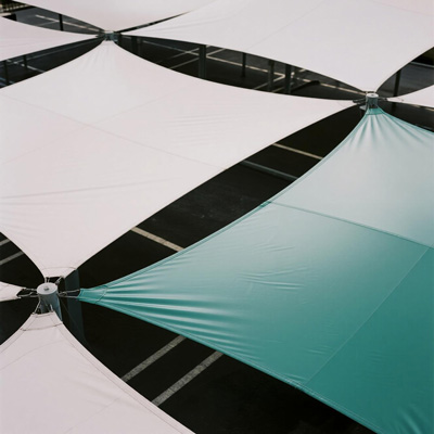 Aerial view of parking lot with shade cloth canopies