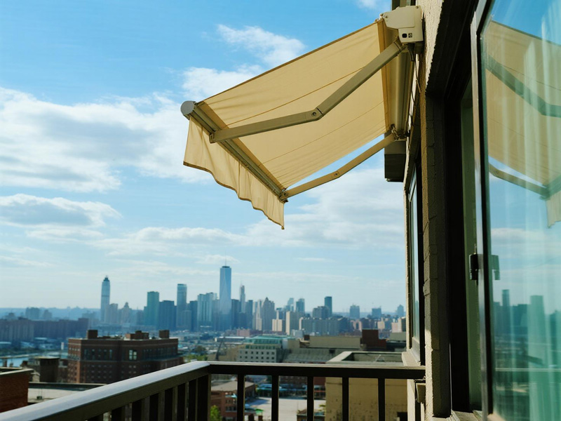 Home patio with transparent rain curtains installed, protecting the outdoor seating area from rain while maintaining visibility