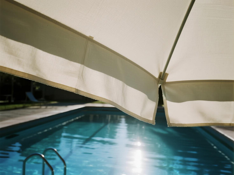 Close-up of pool area rain cover material showing water resistance
