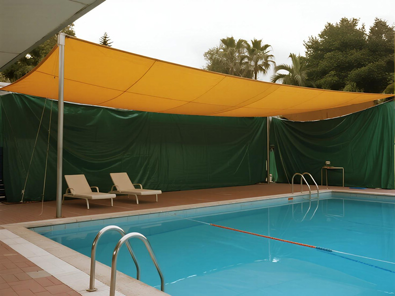 Retractable pool area rain cover system