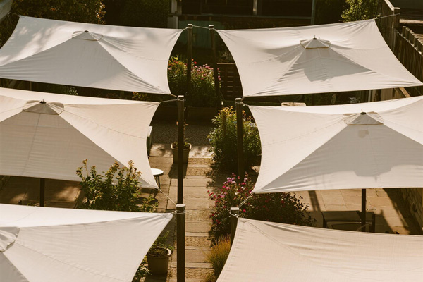 Residential garden path with rain cover protecting visitors during rain