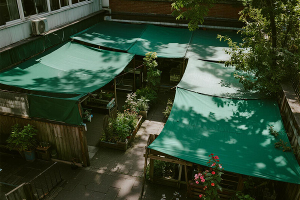 Garden nursery walkways with rain covers protecting customers