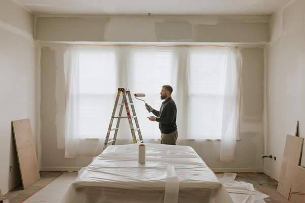 Furniture covered during interior painting project