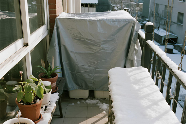 Protected balcony with plants during winter