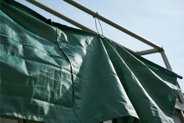 Balcony temporary rain covers providing protection from rain and wind