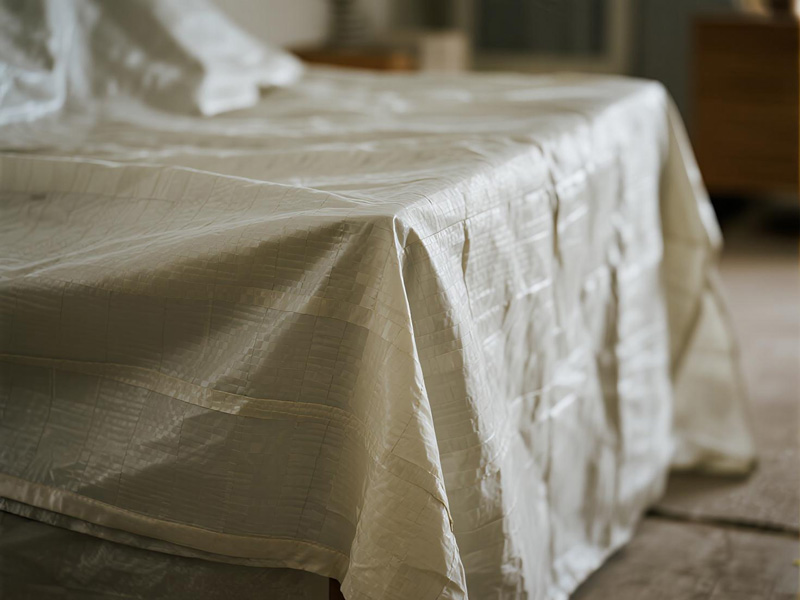 Furniture covered with protective sheets during home renovation