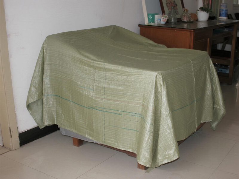 Dust cover protecting a sofa during storage
