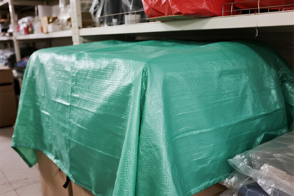 Holiday decorations protected in storage boxes with dust covers