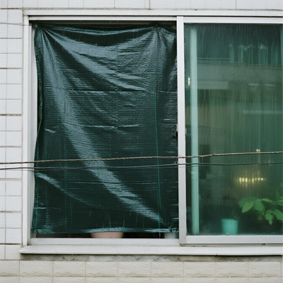 Close-up of secure taping technique for emergency cover