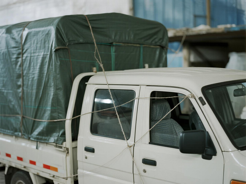 Close-up of reinforced edges on truck tarpaulin