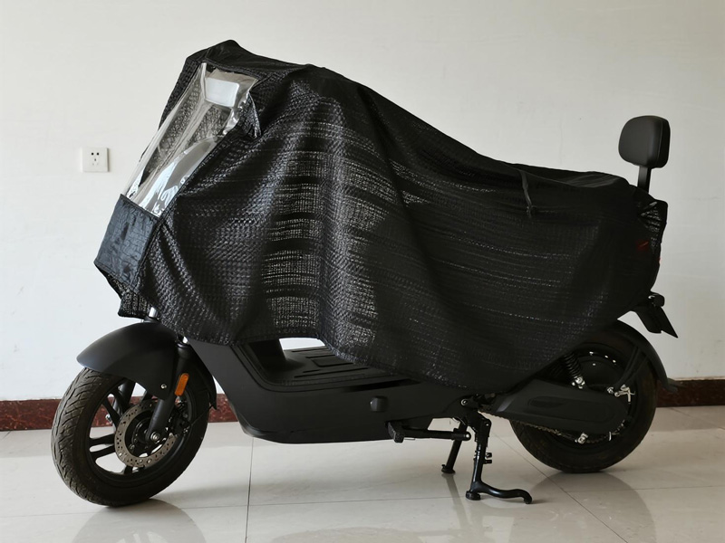 Electric bike covered with waterproof rain cover with mesh panels