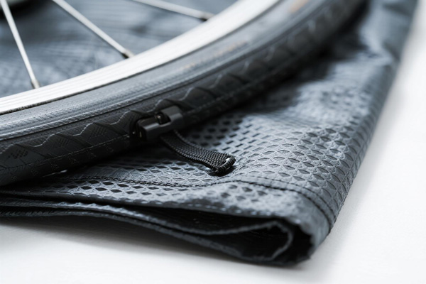 Road bicycle covered with protective rain cover