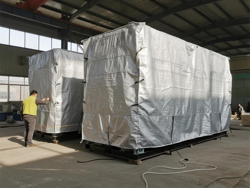 Patio furniture set covered with protective dust cover during storage