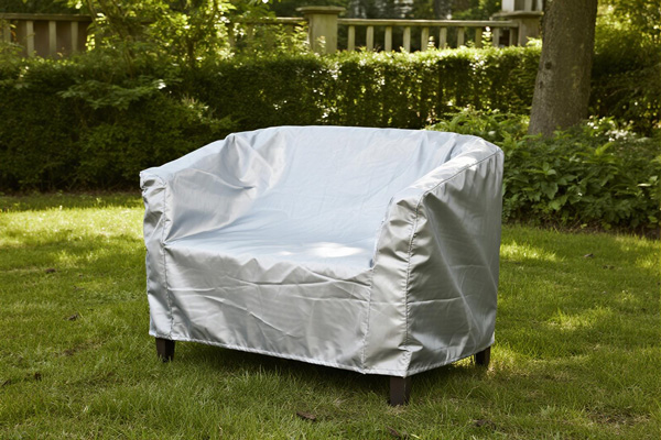 Patio furniture set covered with dust protection cover