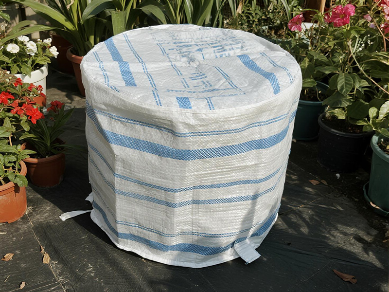 Drawstring closure system on plant pot frost cover
