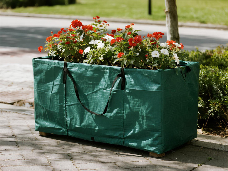 Outdoor planters protected by rain covers in a garden setting