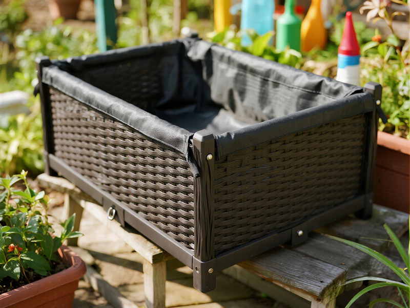 Planter rain cover during rainfall showing water resistance
