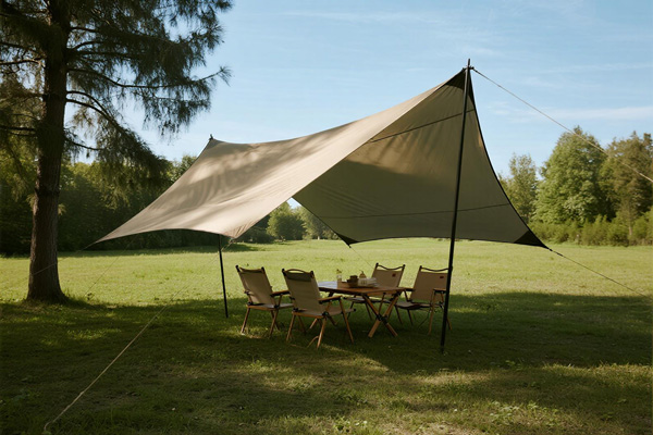 Sun shade tarp at campsite over picnic table