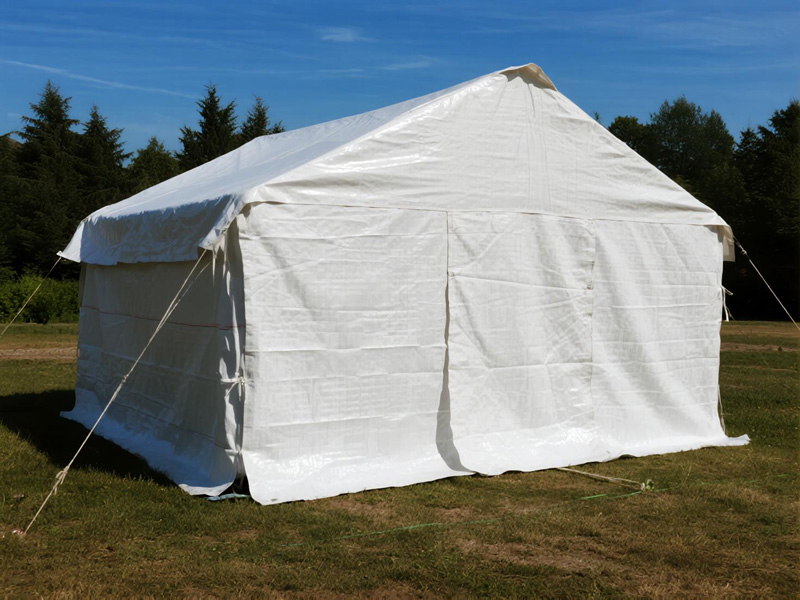 Sun shade tarp being set up at outdoor event