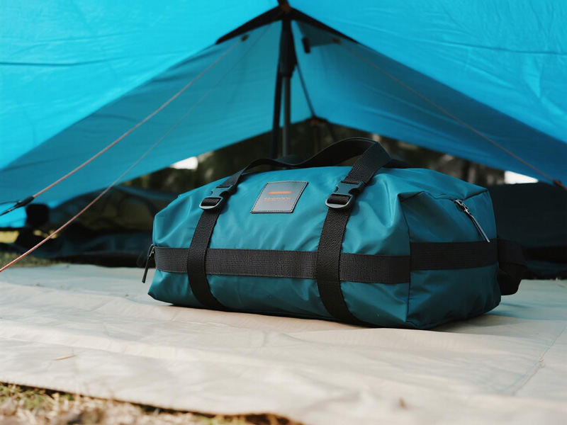 Waterproof storage tarp in use with camping equipment
