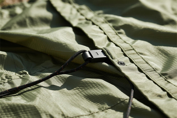 Waterproof storage tarp covering gear in garage