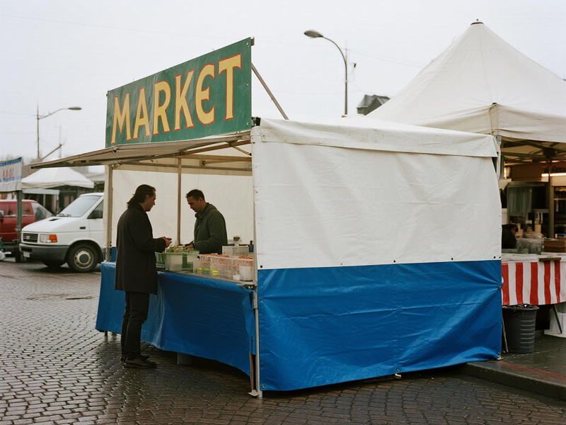Market stall tarp showing secure attachment and professional appearance