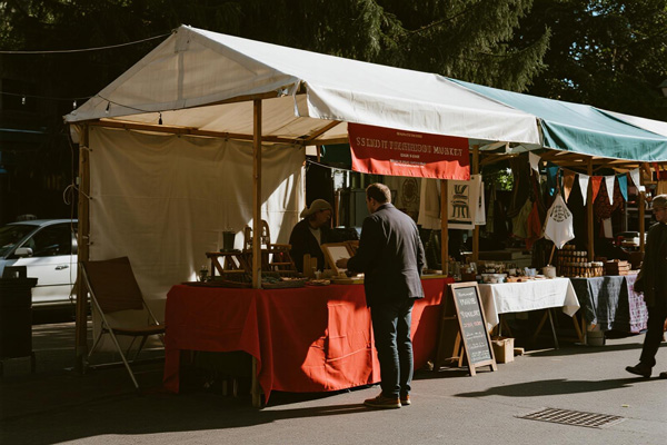 Craft market stall protected by tarp