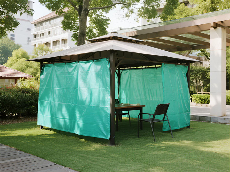 Outdoor BBQ area protected by rain cover during light rain